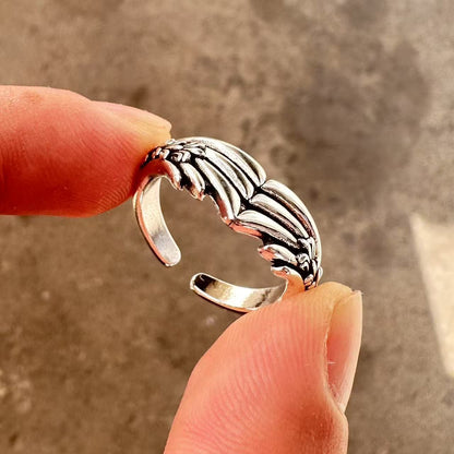 Men's ring with adjustable wide face opening